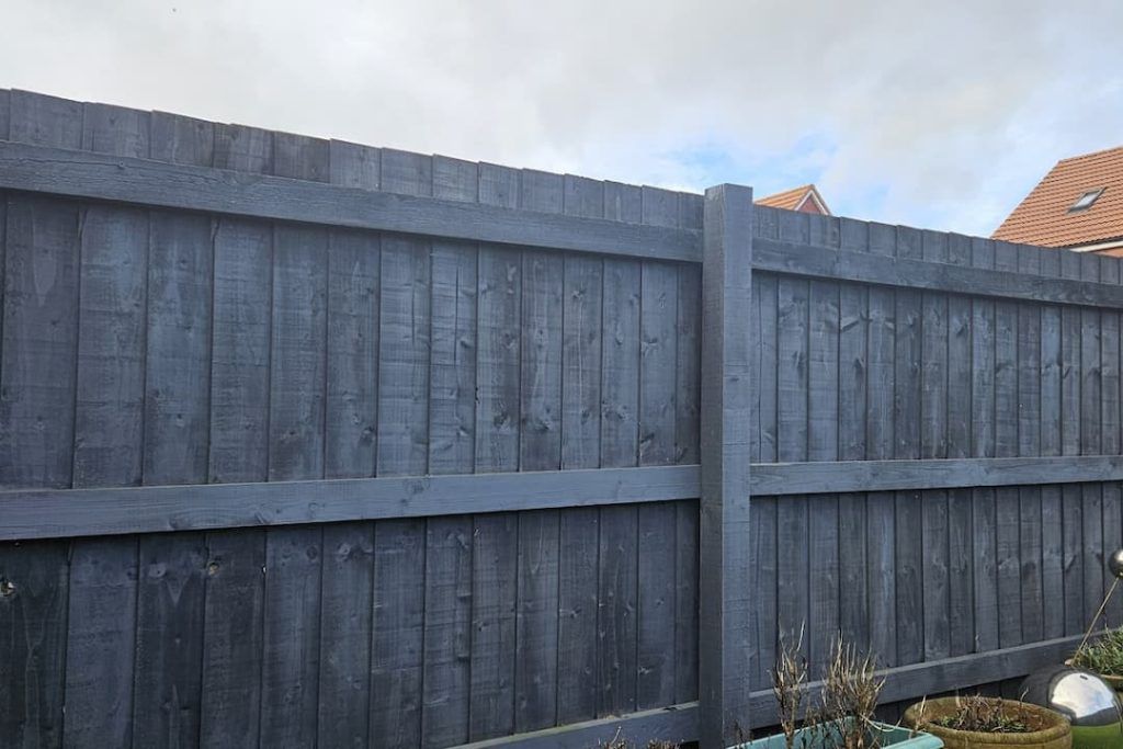 Grey featherboard fencing