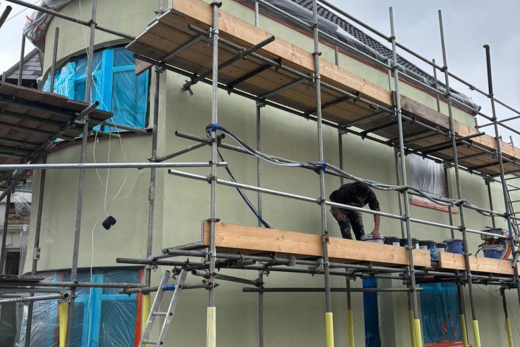 a man standing on a scaffolding