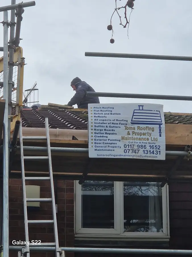 a man on a roof
